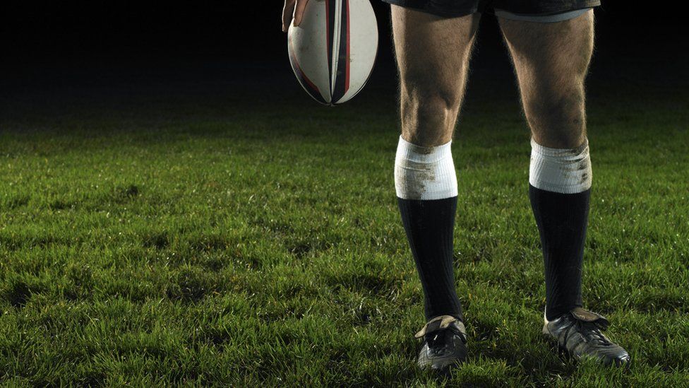 anonymous picture of a rugby player holding a ball