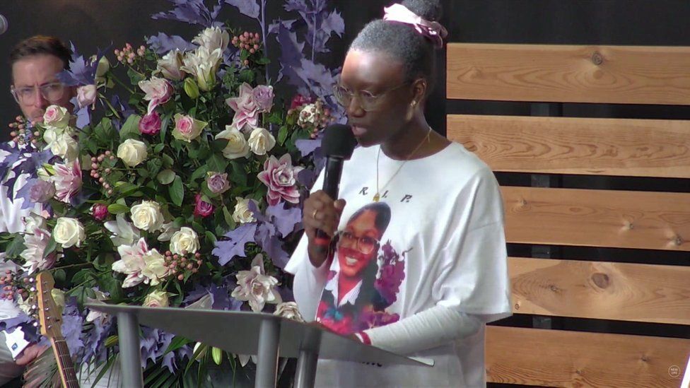 Elianne's aunt Sylvia reading a eulogy