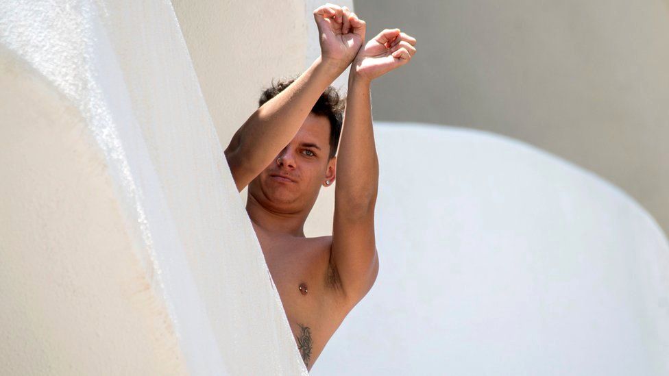 A student reacts from a balcony at Palma Bellver in Palma de Mallorca, Balearic Islands, Spain, 28 June 2021