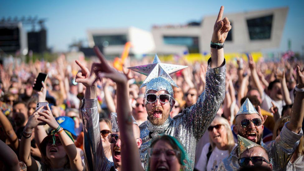 man celebrating eurovision in liverpool in star outfit