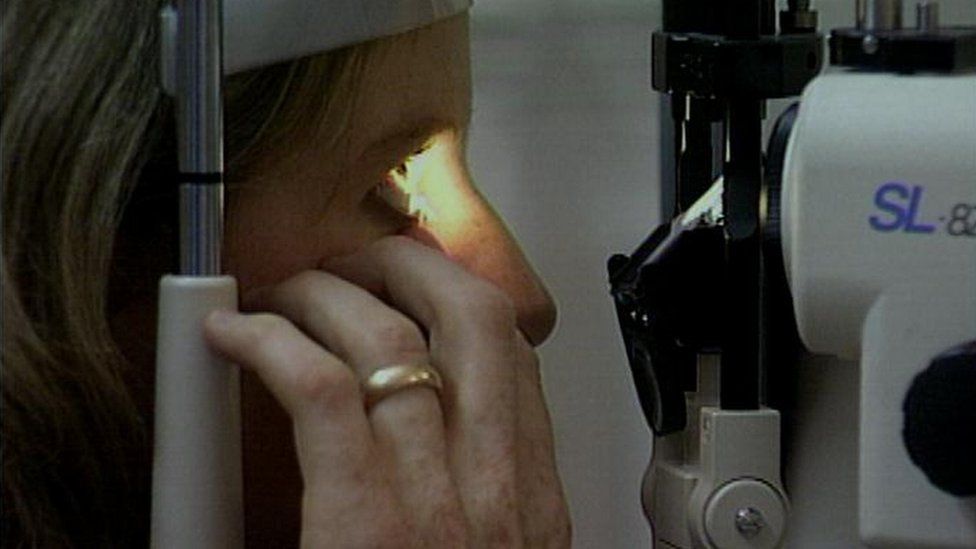 Woman being given an eye test