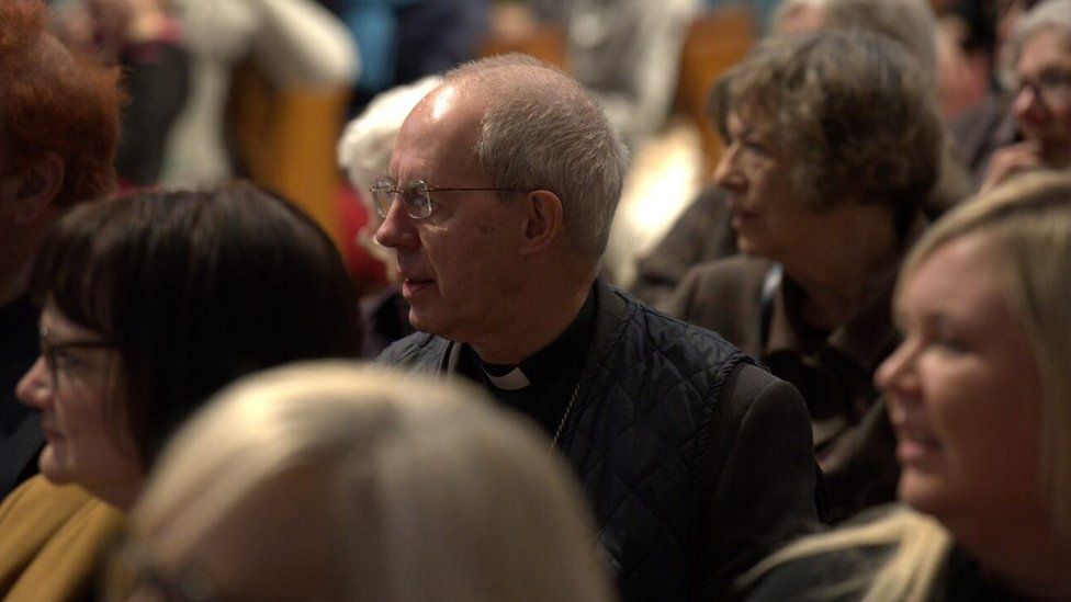The Archbishop of Canterbury sitting among the congregation