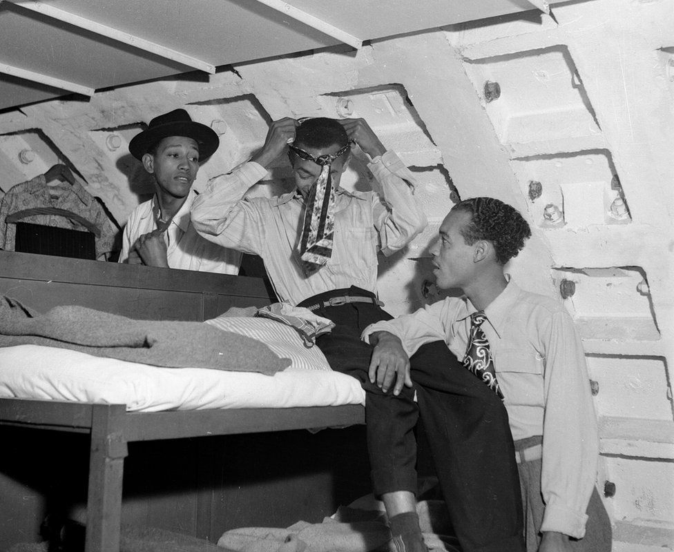 Immigrants Kenneth Murray, Eric Dryndale and Aston Robinson are seen in an ex-air raid shelter in 1948
