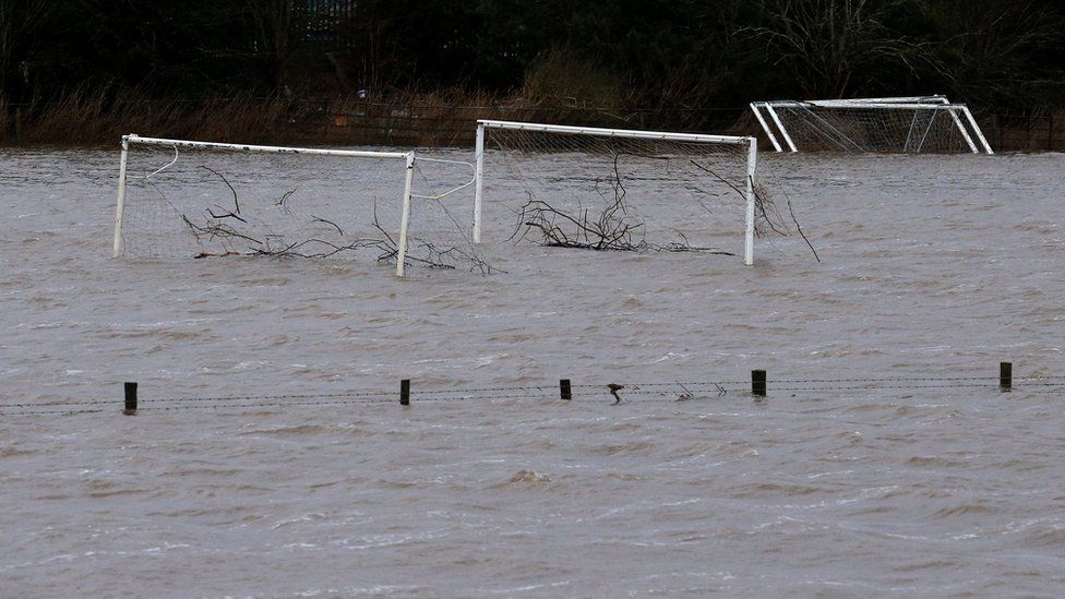 Tree debris was washed away on flooded football pitches in Tadcaster, North Yorkshire