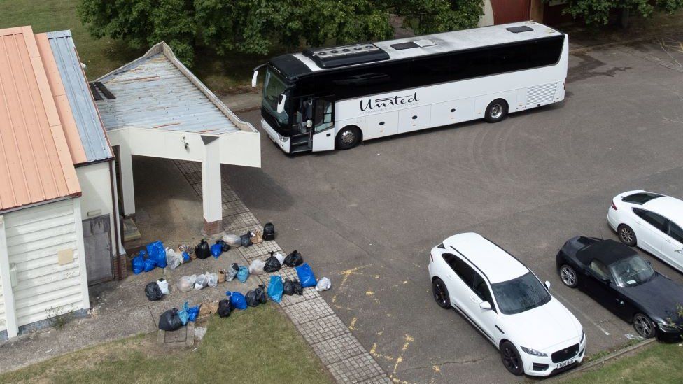 A bus is seen arriving at Wethersfield air base it is thought to have brought in 46 migrnats who will now live on site