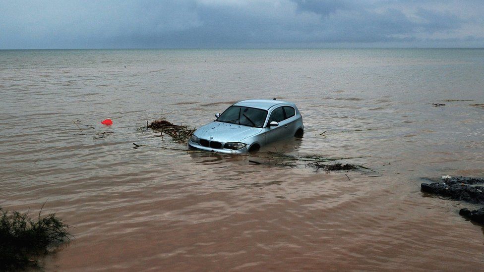 A car washed out the sea following floods caused by heavy overnight rain in Thessaloniki, 7 September 2016