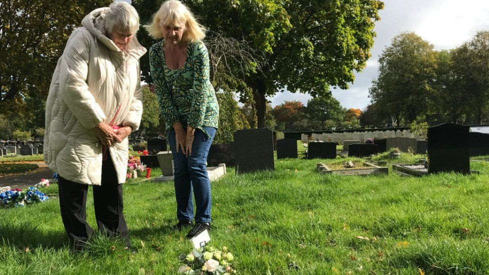 Anne Howard, pictured with her daughter Jane, at her other daughter's grave