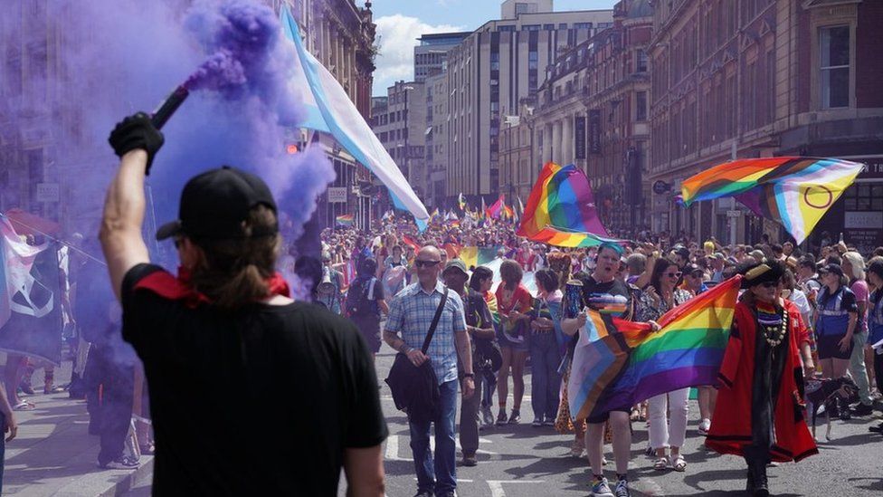 A purple flare set of at the pride march