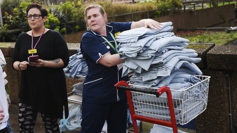 Nurses from St Thomas's Hospital pile up blankets for the injured.