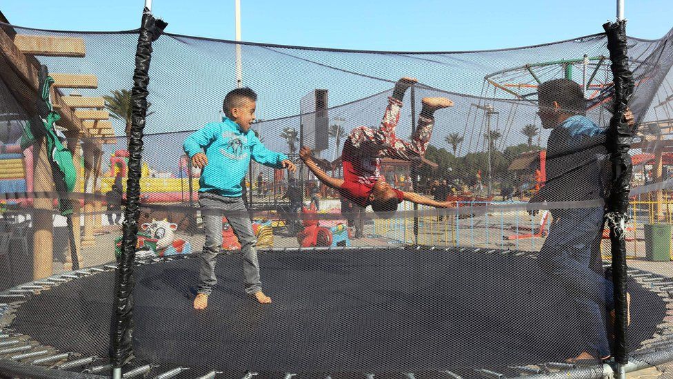 Children bouncing on a trampoline in Tripoli, Libya - Wednesday 15 February 2017