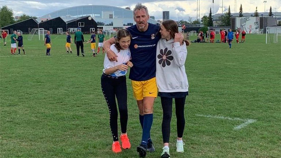 Antony Evans with his daughters