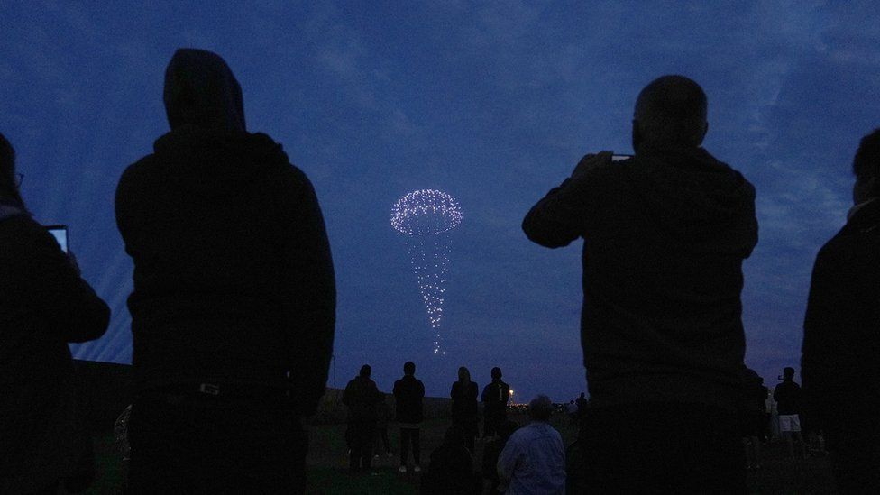 Drones create a parachute  during a drone display over Portsmouth