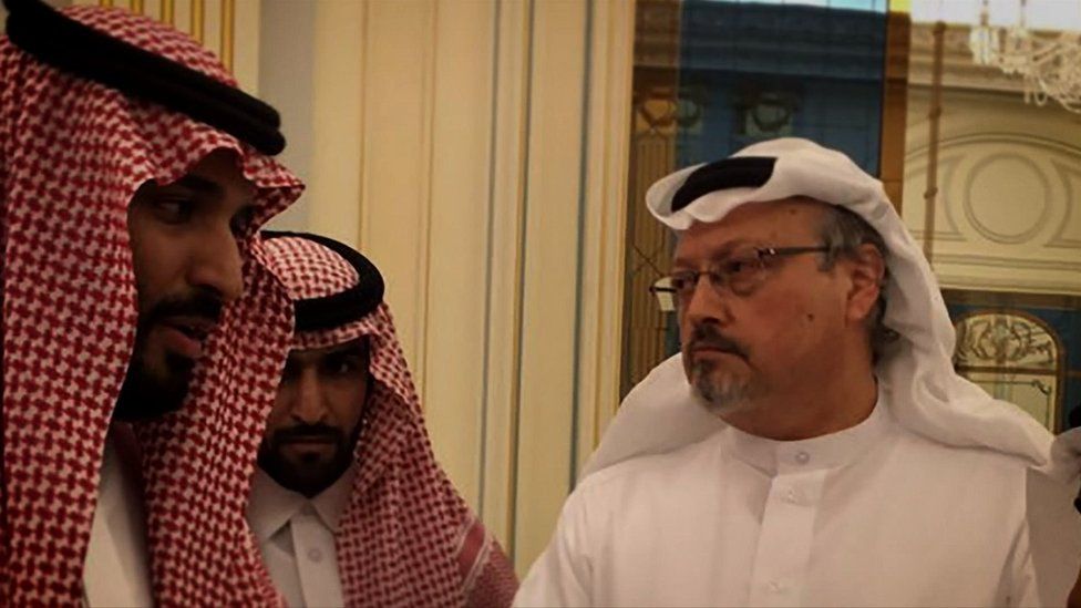 Jamal Khashoggi (right) with two unidentified people