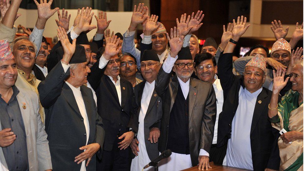 Nepalese prime minister Sushil Koirala (3R),Unified Marxist Leninist chairman K P Oli (4R), Nepalese Unified Communist Party of Nepal (Maoist) chairman Pushpa Kamal Dahal, known better as Prachanda (4L) and other lawmakers celebrate the vote in Kathmandu (16 Sept 2015)