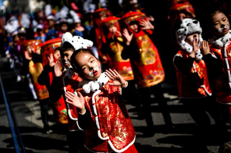 Revellers perform during celebrations for the Chinese New Year parade in Lisbon.