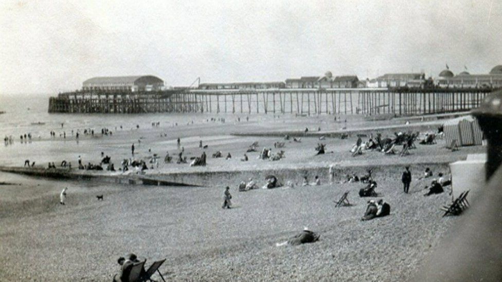 Still from montage of photos of Hastings Pier