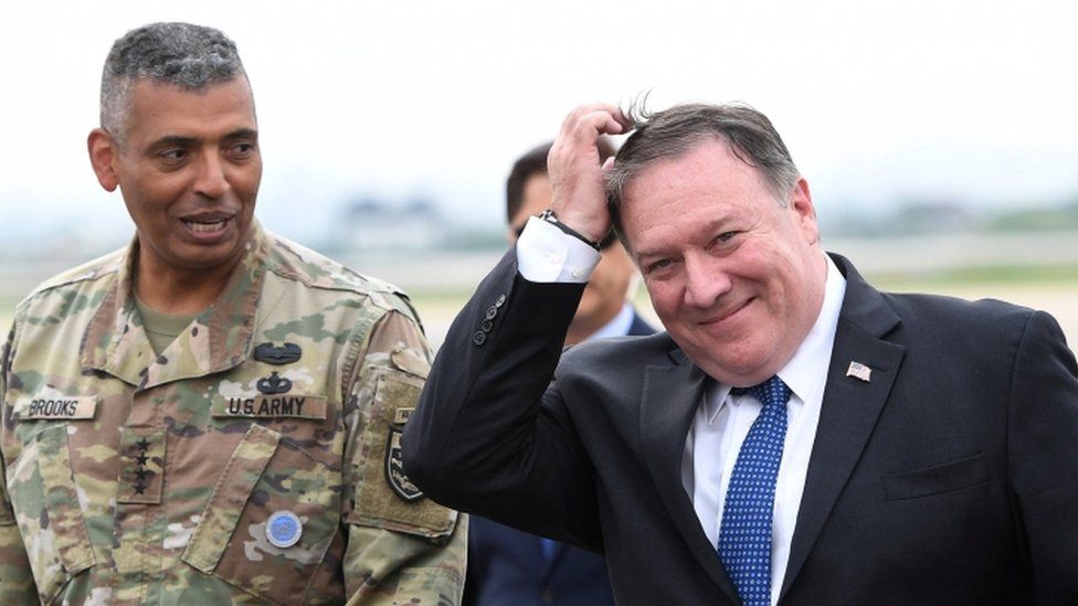 US Secretary of State Mike Pompeo, right, arrives in Seoul, 13 June 2018