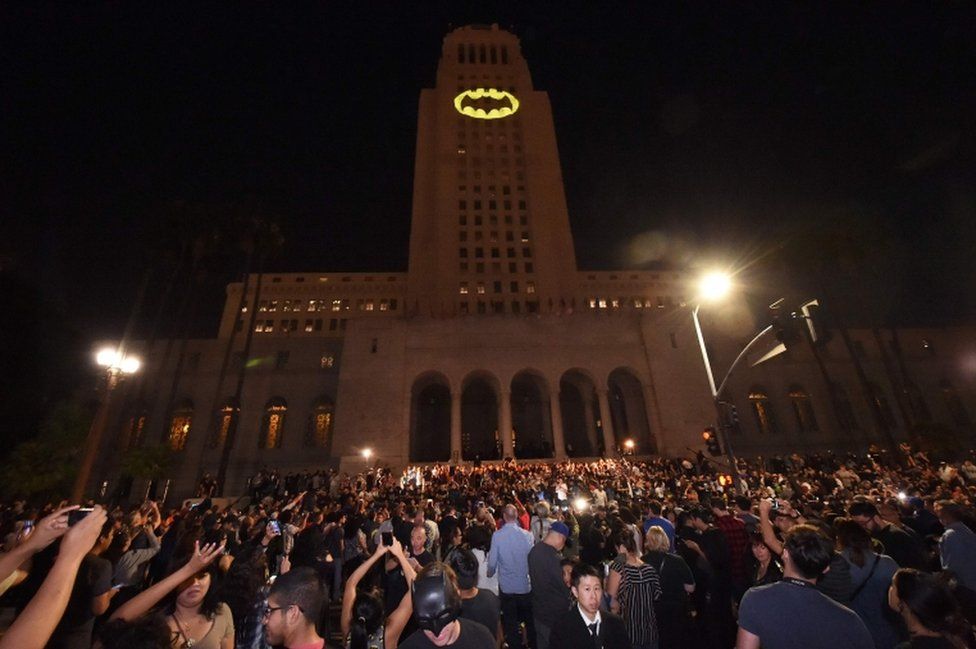 The Batman Bat-signal is projected onto Los Angeles City Hall in a tribute to the late actor Adam West, 15 June, 2017, in Los Angeles, California