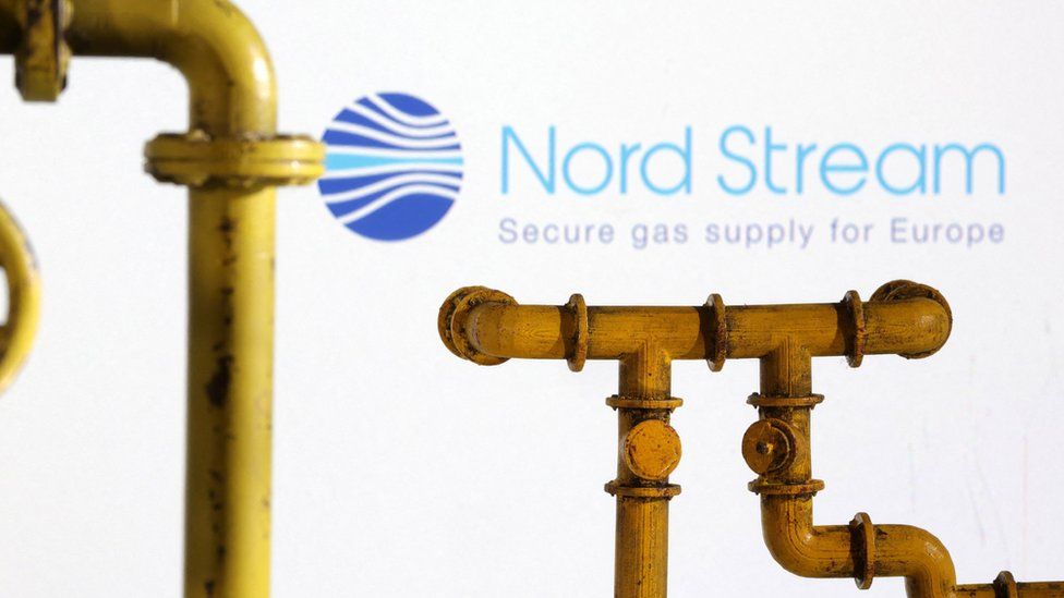 Model of natural gas pipeline and Nord Stream logo, July 18, 2022