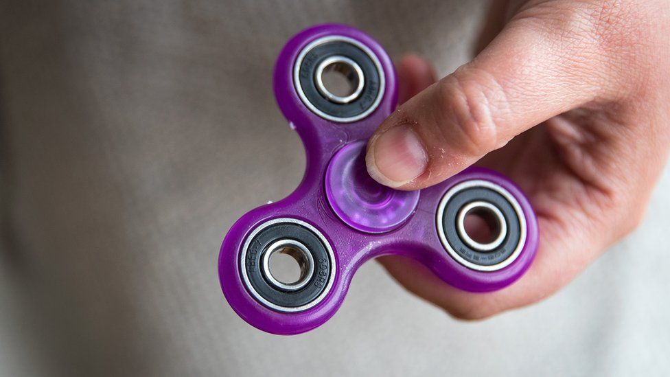 A purple fidget spinner