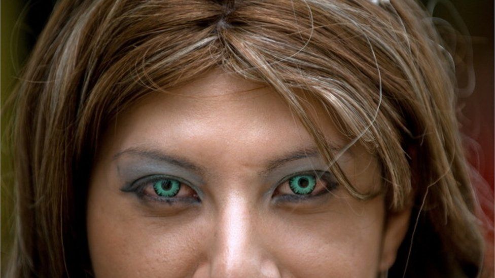 Girl wearing coloured contact lenses