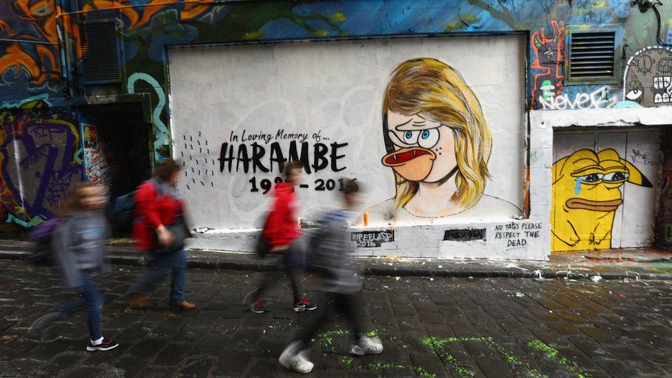 A defaced mural of Taylor Swift