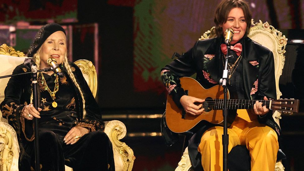 Joni Mitchell performs with Brandi Carlile during the 66th Annual Grammy Awards