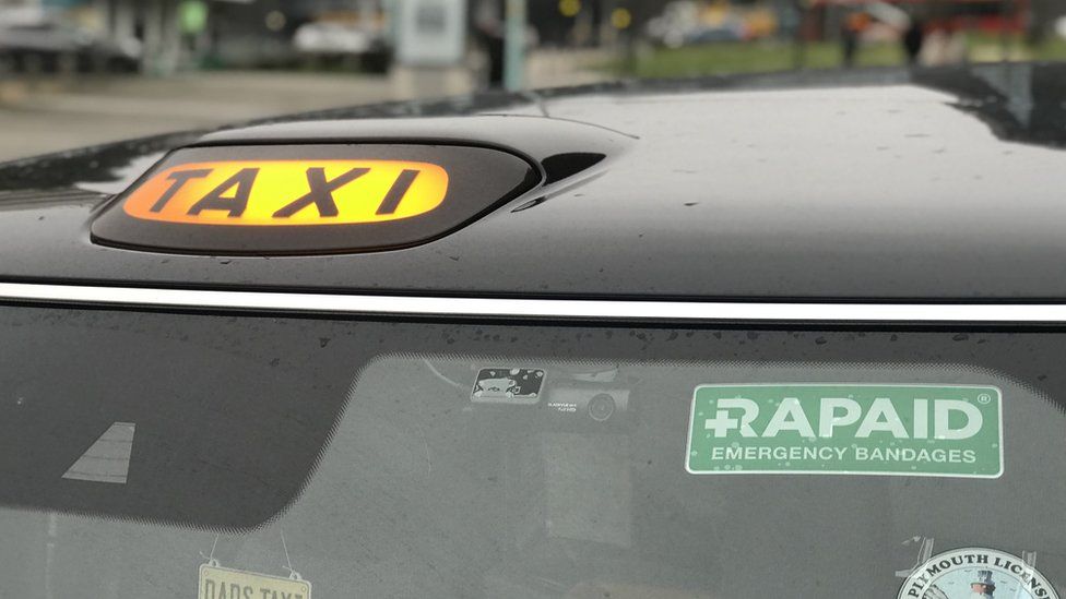 Rapaid sign on a Plymouth taxi
