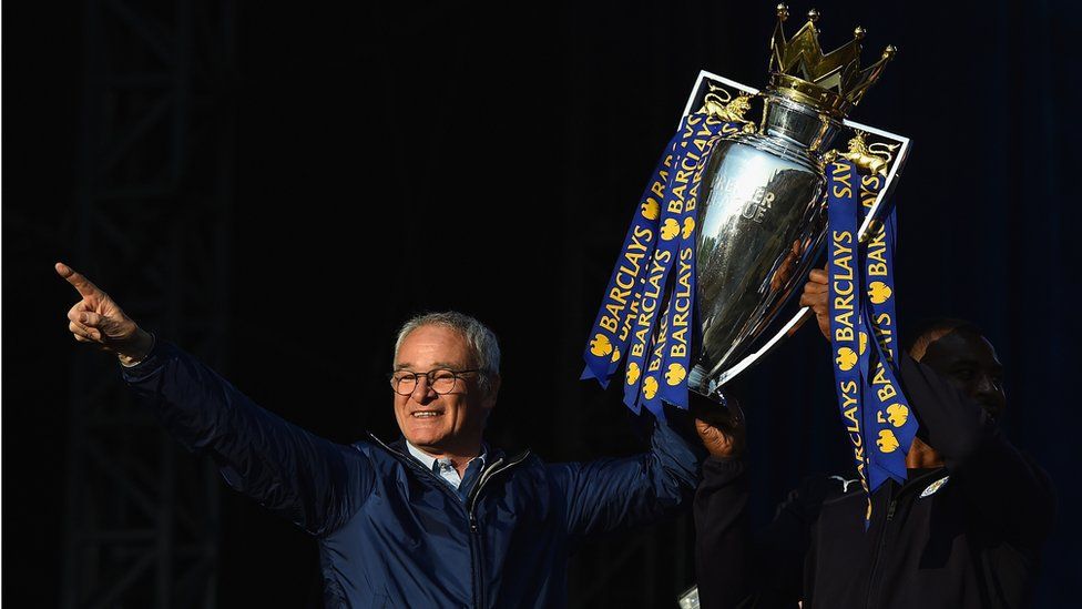 Claudio Ranieri lifts the Premier League cup during Leicester City's victory parade May 2016