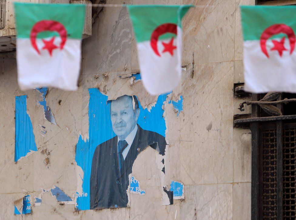 A views shows an old poster of former Algerian President Abdelaziz Bouteflika.