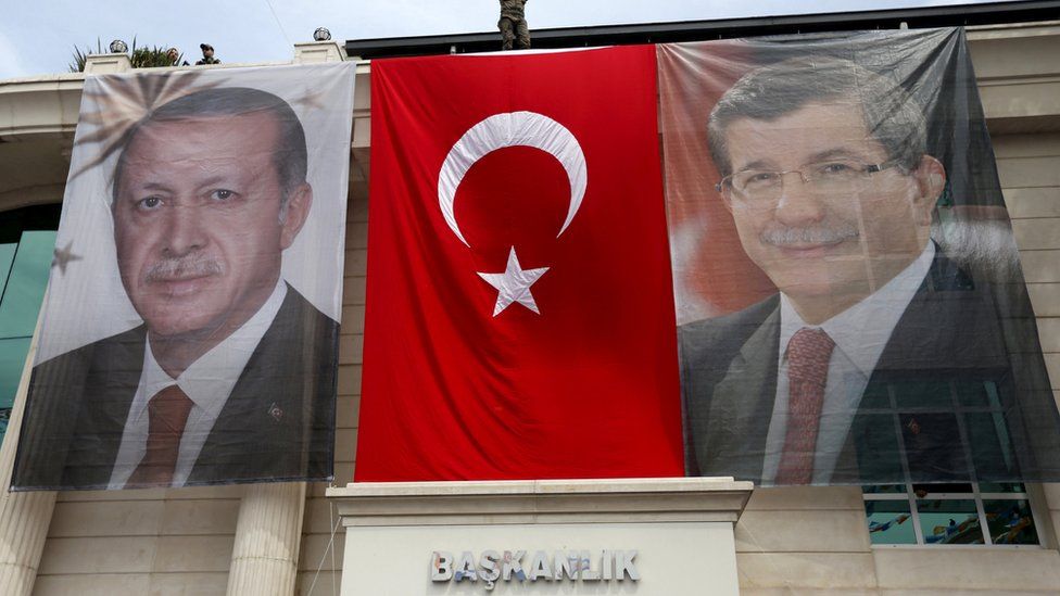 Portraits of Turkey"s President Tayyip Erdogan (L), Prime Minister Ahmet Davutoglu (file pic June 2015)
