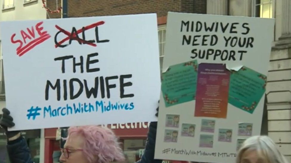 Banners at a march to support midwives