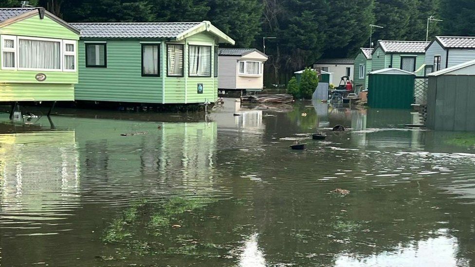 Mobile holiday homes surrounded by water