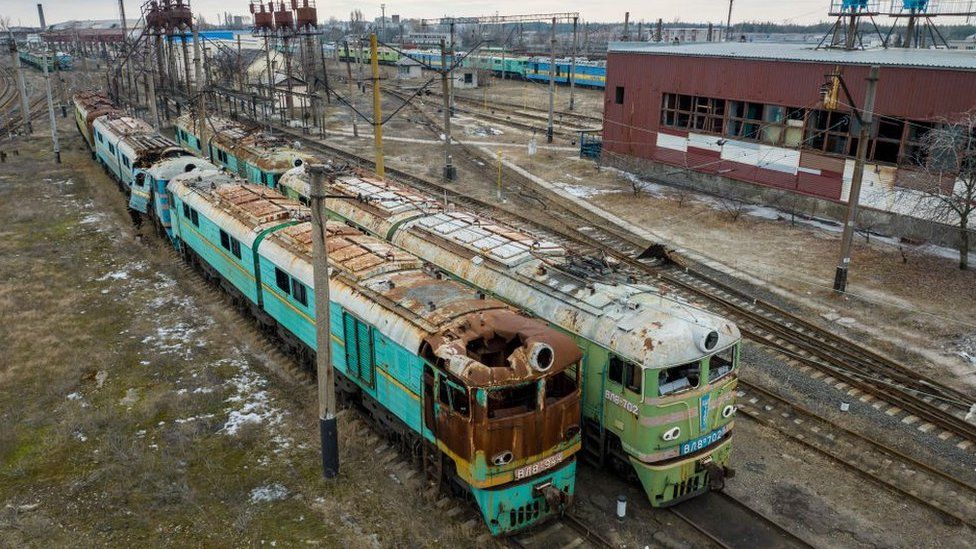 Disused trains pictured in a rail yard in Lyman, Ukraine