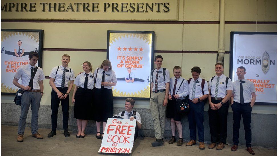 Missionaries from the Church of Jesus Christ of Latter-Day Saints outside the opening night of the Book of Mormon musical in Liverpool