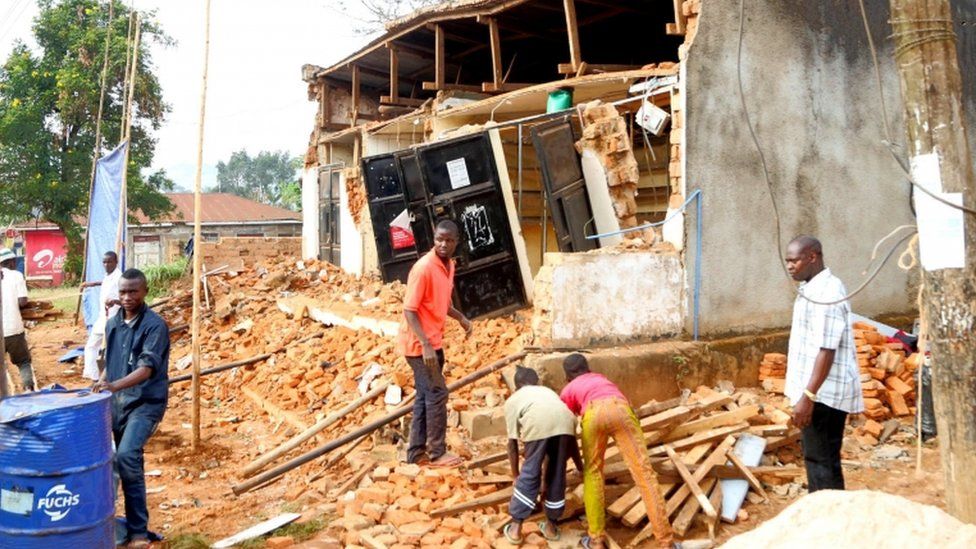 People remove wreckage of a house damaged following an earthquake measured 5.7 magnitude which struck the countrys Lake Zone in Bukoba, northwest Tanzania, on September 10, 2016.