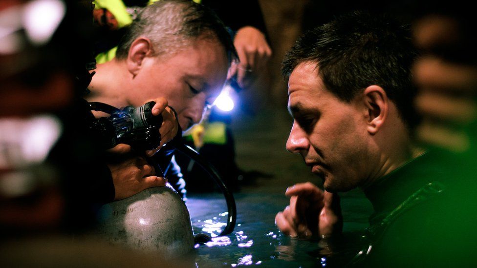 Cave divers Tan Xiaolong and Jim Warny preparing for a scene