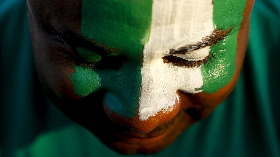 A man with a painted Nigerian face
