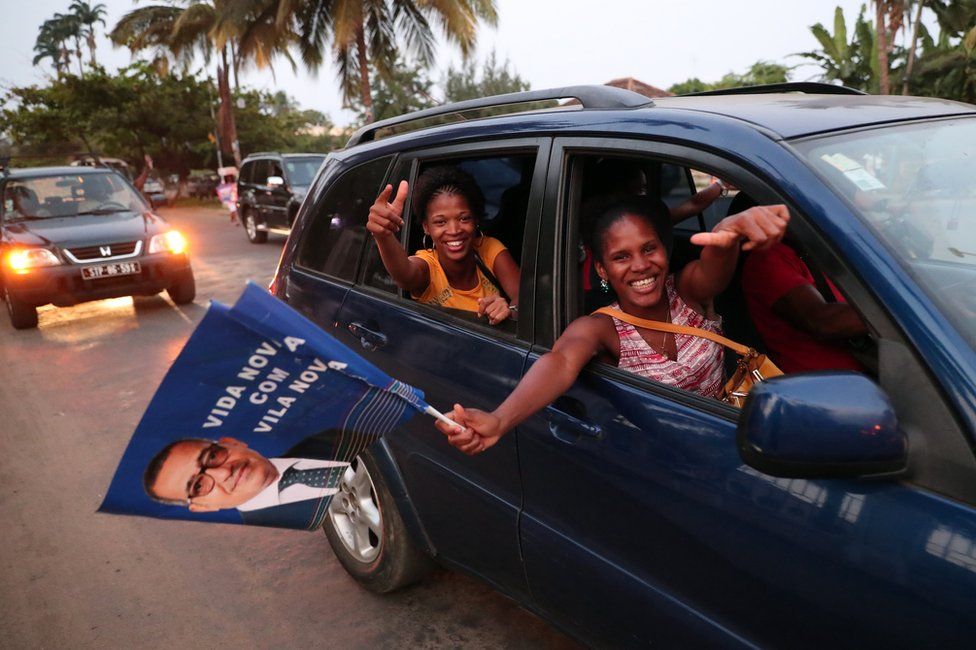 Supporters of presidential candidate Vila Nova celebrate the provisional results of the presidential elections, in Sao Tome, Sao Tome and Principe.
