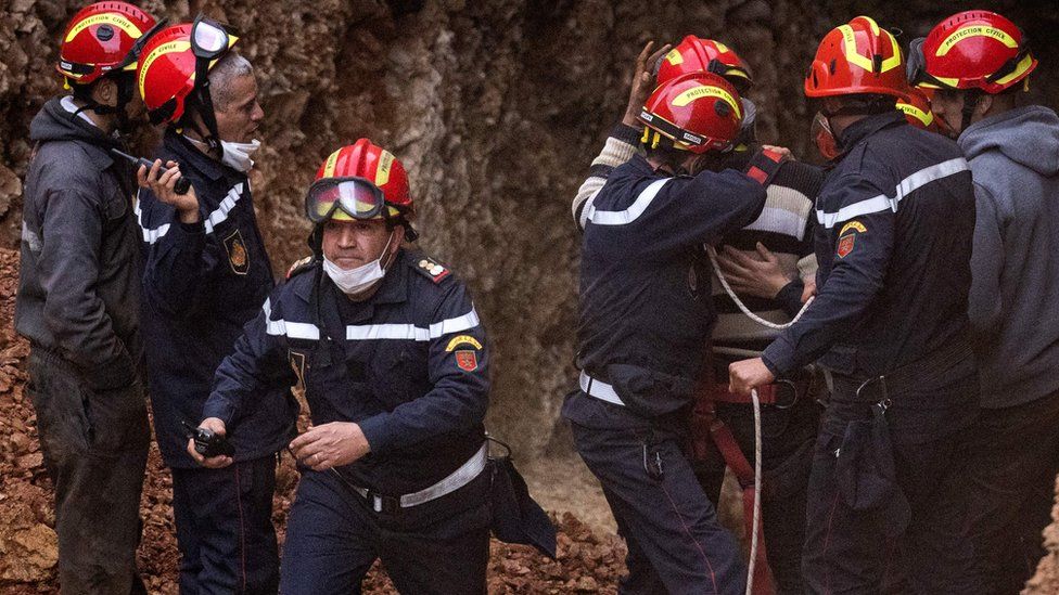 Moroccan emergency services personnel at the site where five-year-old Rayan fell into a well shaft