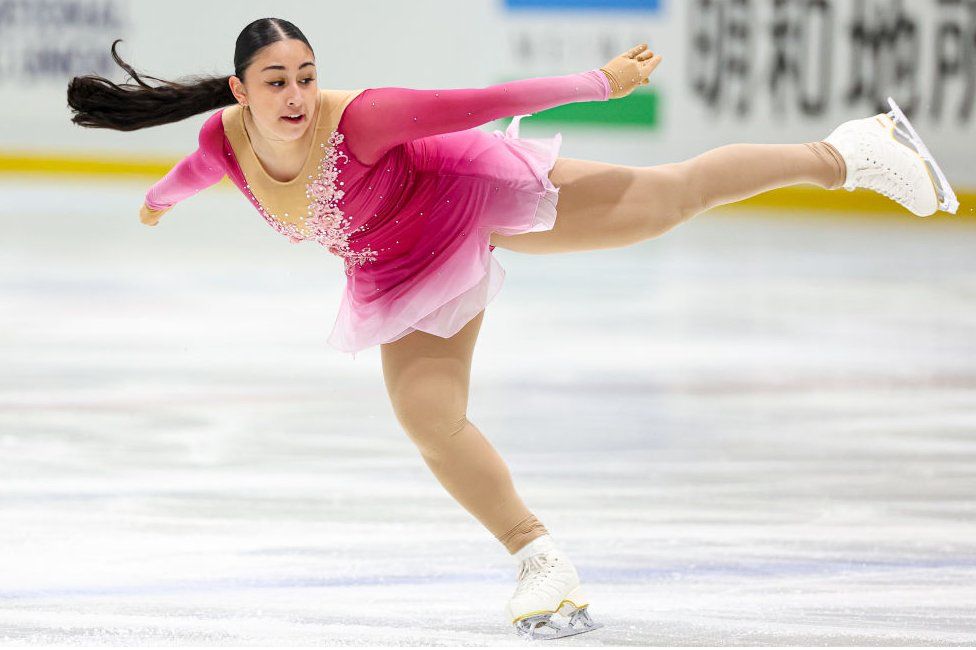 Woman skating on ice, 25 August