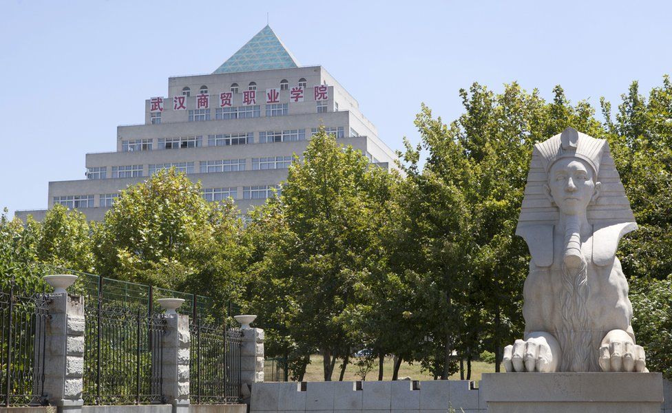 A replica of the Great Sphinx (right) in the foreground, with a step-pyramid shaped building, which is actually a library, behind, in Wuhan, central China, on 9 August 2013.