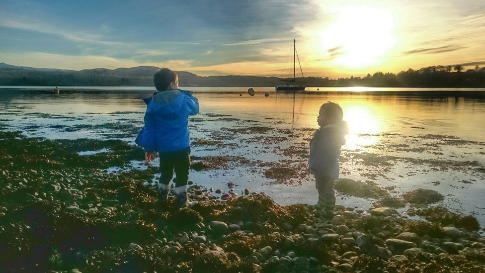 Children play by Loch Etive