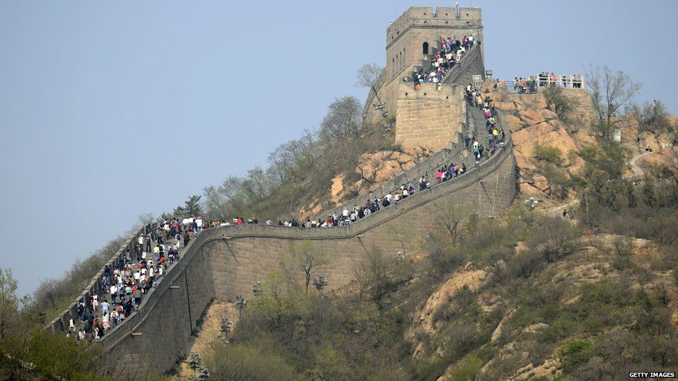 Tourists visit the Great wall in Beijing on 4 May, 2013