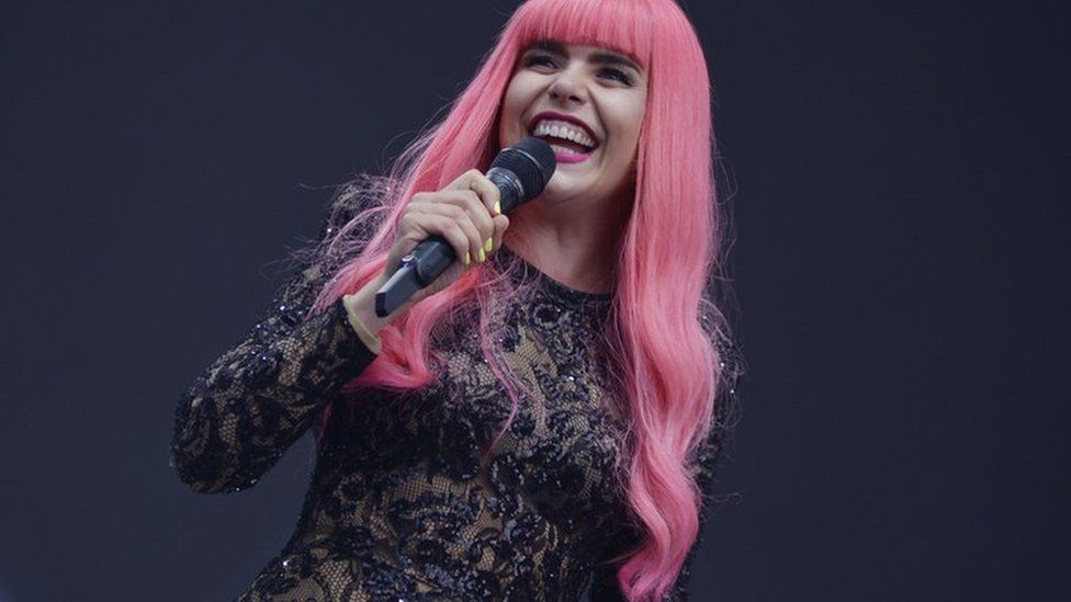 Paloma Faith on stage with pink hair