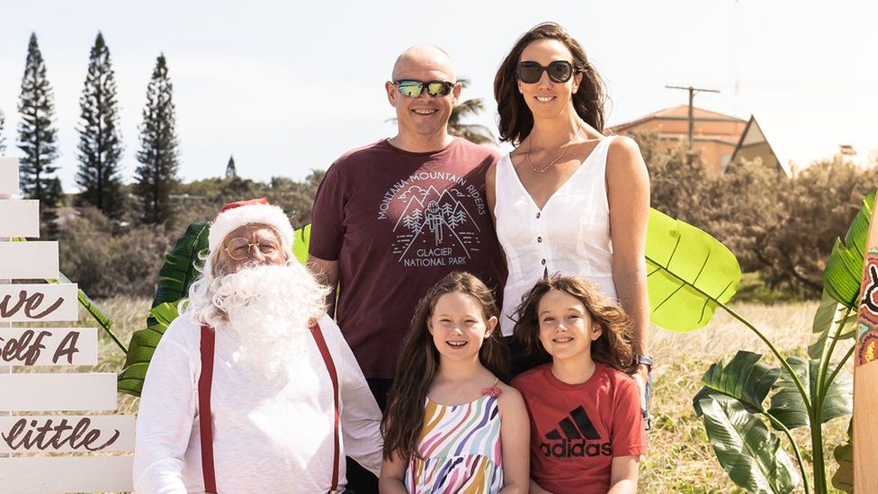 Keri McMenamin's family post for a Christmas photo last year