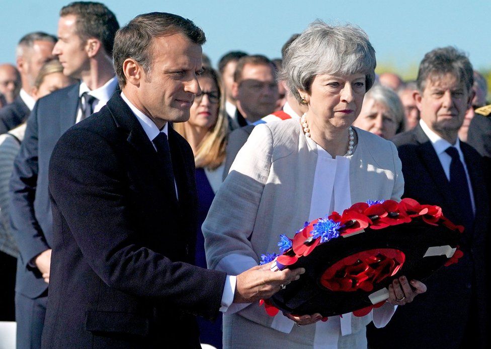 Mrs May and Mr Macron lay a wreath together