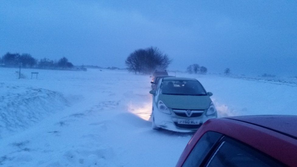 Cars stuck in snow
