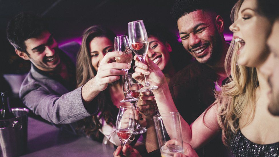 Group of friends drinking stock image