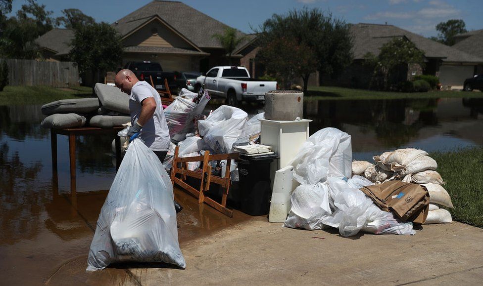 Homeowner clears debris
